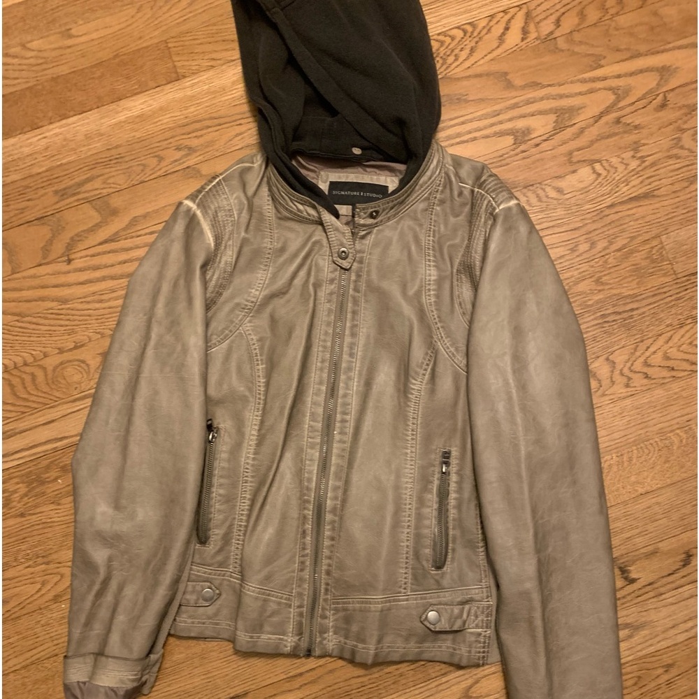 Signature studio, pho, leather jacket
With a hood